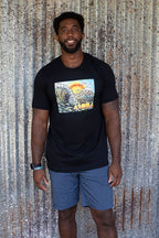 Man wearing Cartoon drawing of west side Maui beach surf spot designed in Big Island Hawaii and printed in Maui, Hawaii