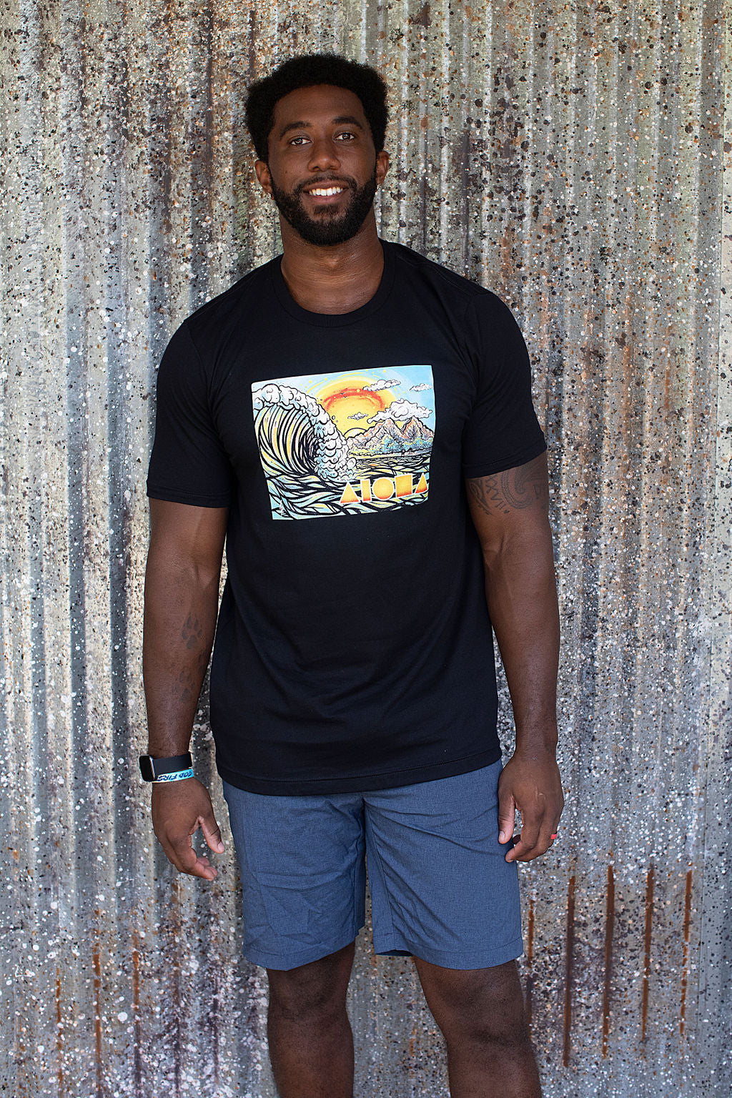 Man wearing Cartoon drawing of west side Maui beach surf spot designed in Big Island Hawaii and printed in Maui, Hawaii