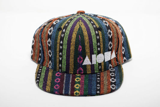 Multicolored striped Guatemalan fabric toddler flat brim snapback hat embroidered with white Aloha Shapes ® logo