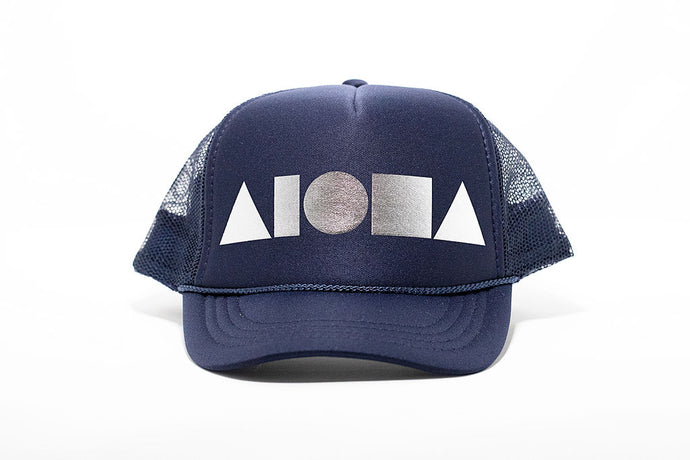 Navy blue youth trucker hat foil printed with metallic silver Aloha Shapes ® logo. Designed in Maui, Hawaii